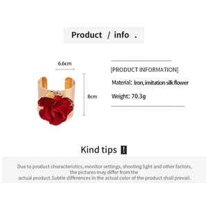 Detail view of large red silk flower on gold wide cuff armlet with size dimensions