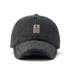 Dark grey knitted baseball cap for seniors with warm fleece lining and leather logo patch