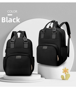 Front and side view of a large black nylon backpack with a Fashion leather label