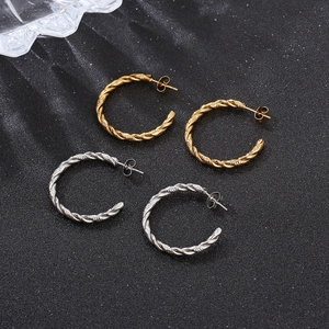 Classic gold and silver twisted hoop earrings in a stylish C-shape design for women