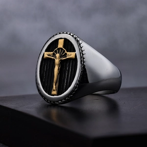 Men's two-tone stainless steel signet ring with golden cross design on dark base