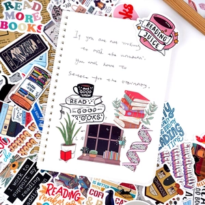 Waterproof reading stickers with book and coffee designs on a spiral notebook