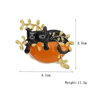 Creative black cat on pumpkin enamel brooch pin with golden leaves and blue eyes