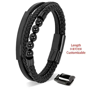 Macro shot of black multi-layer woven leather bracelet with steel beads and magnetic buckle