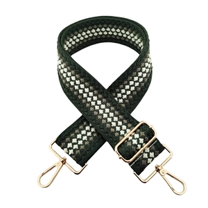 Adjustable green woven bag strap with geometric patterns and gold metal buckles