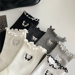 White cotton mid-calf socks with ruffles and bow embroidery in multiple colors