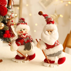 Christmas plush dolls featuring Santa and Snowman with wooden skis on festive background