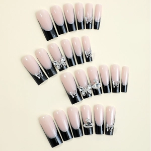 Extra long black French press-on nails with silver butterfly and rhinestone 3D charms