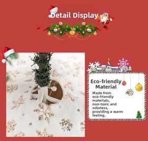 Close-up of white plush Christmas tree skirt with shiny golden sequin snowflake embroidery