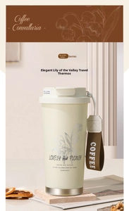 Detail of cream Lily of the Valley coffee tumbler with woven strap and floral patterns