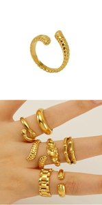 Detail of adjustable gold twisted croissant ring showing textured surface on hand