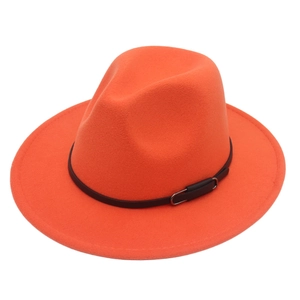 Detailed shot of bright orange fedora hat featuring a black leather belt with metal buckle