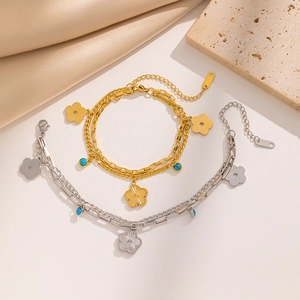 Double-layered 18k gold plated stainless steel bracelets with flower charms and blue beads