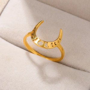 Detail of 18k gold plated stainless steel ring with hollow moon phase design on velvet