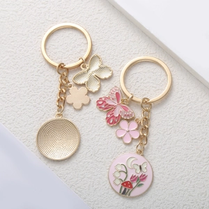Pink flower butterfly charms keychain with tulip and mushroom enamel pendants