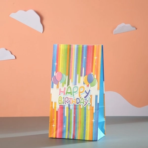 Rainbow striped kraft paper birthday gift bag featuring colorful balloons and festive text