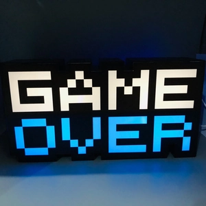 Detailed view of the GAME OVER LED pixel light with blue and white glowing letters