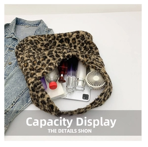 Detail showing the large capacity of a leopard print plush tote bag holding a tablet