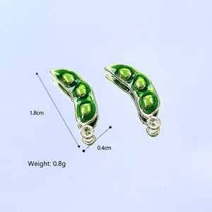 Detail view of 1.8cm green pea pod enamel pendant with 0.8g weight for DIY jewelry