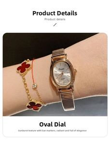 Detail view of a rose gold oval quartz watch with sunray dial and gold indices