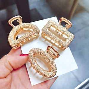 Three-piece gold alloy geometric hair clips with frosted matte and glitter texture