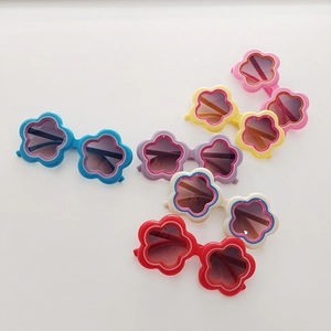 Close-up of flower shaped children sunglasses in diverse pastel and bright colors