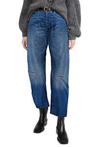 Detail view of high-waist cargo jeans with utility pockets and distressed denim texture