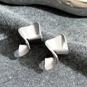 Exaggerated irregular silver wave alloy earrings with glossy metallic finish