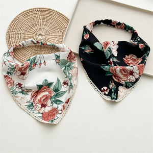 Detail of floral headscarf showing intricate lace trim and elastic band structure