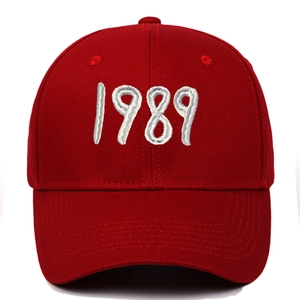 Close-up of red baseball cap with high-quality white 1989 embroidery on front
