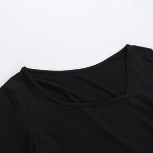 Close-up of the square neckline and fine stitching on this black slim-fit casual top