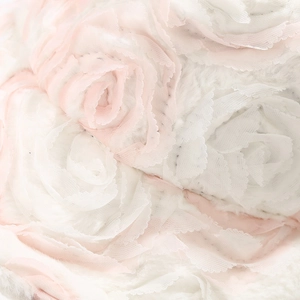 Macro shot of pink and white 3D fabric rose texture on a thick warm winter bucket hat