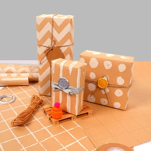 Vintage kraft gift wrapping paper set with polka dots, stripes and twine ties