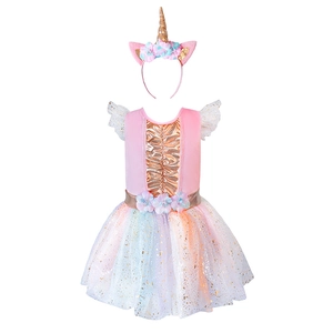 Close-up of pink unicorn tutu dress with rainbow mesh skirt and floral waist detailing