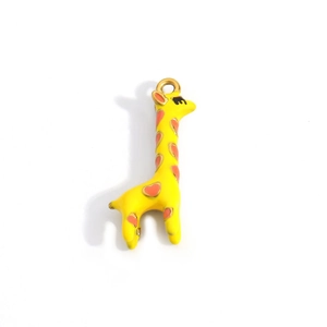 Detail of yellow giraffe pendant with orange heart spots and golden hanging ring