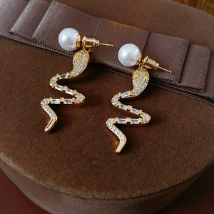 14K gold plated serpent drop earrings with pearls and cubic zirconia in a jewelry box