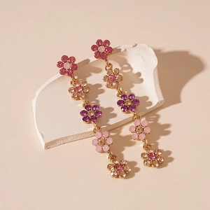 Boucles d'oreilles pendantes dorées avec pétales de fleurs en cristal dégradé