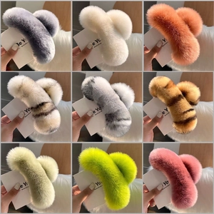 Collection of oversized plush faux fur hair claws in nine various colors and patterns