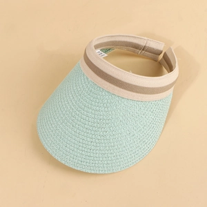 Detailed weave pattern of the mint green straw sun hat brim and elastic headband