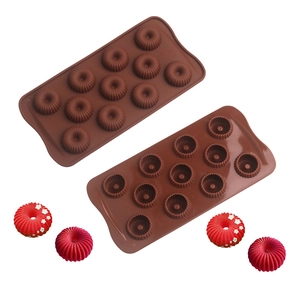 Detail of 12-cavity silicone mold with ring-shaped chocolate and floral cake designs