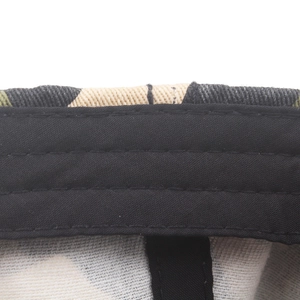 Internal detail of camouflage cotton baseball cap showing sweatband and stitching
