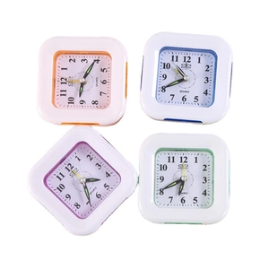 Set of four colorful square minimalist plastic quartz alarm clocks in pink blue purple green