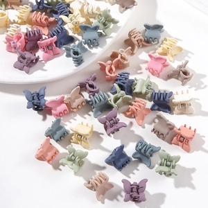 Mix of colorful butterfly mini hair claws for girls in pastel colors on white background