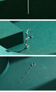 Close-up of S925 sterling silver earrings with colorful gems and chain tassels