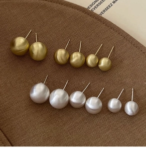 Detail view of 6 pairs minimalist brushed gold ball and white pearl stud earring set