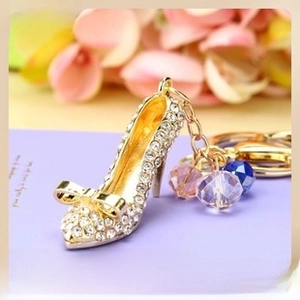 Macro detail of high heel keychain with sparkling rhinestones and colorful crystal beads
