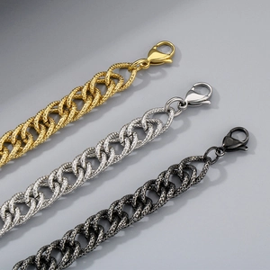 Detailed view of woven curb chains in gold, silver, and black finishes with lobster clasps