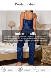 Detail of navy blue satin sleepwear set showing high-gloss texture and luxury drape