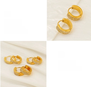 Close-up of gold round earrings featuring three rows of pavé set white zircon stones
