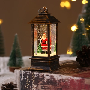 Close-up of a bronze vintage Christmas lantern with Santa scene and glowing LED lights